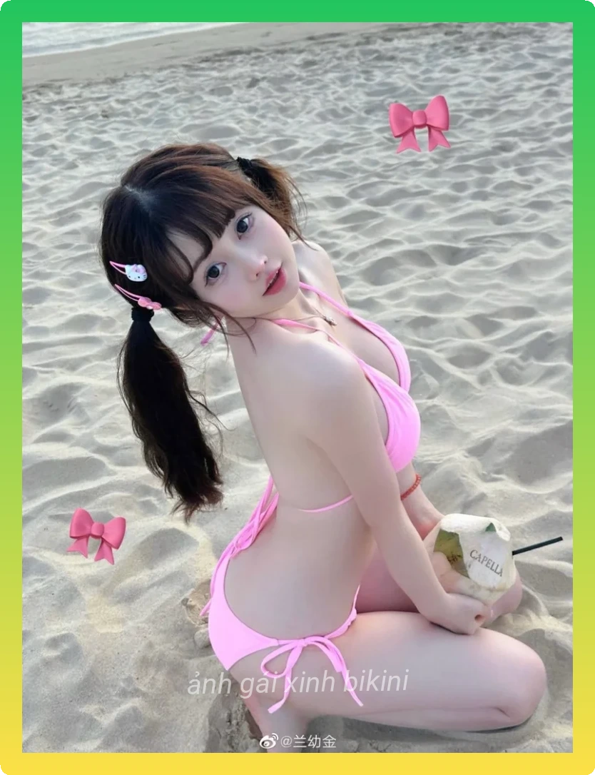 Gai xinh bikini tao dang quyen ru tren cat trang