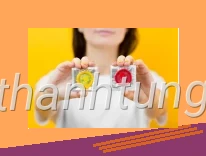 Person holding hands two condoms